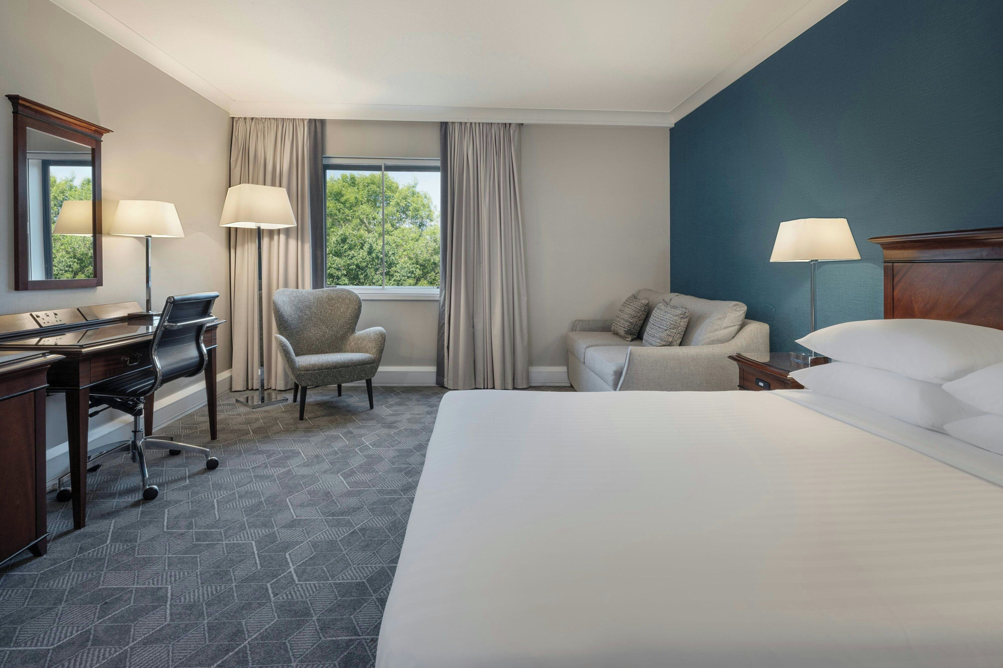 deluxe room, 1 king bed with sofa bed, non smoking | premium bedding, in-room safe, desk, blackout curtains