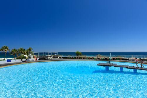 Indoor pool, seasonal outdoor pool, pool umbrellas, pool loungers