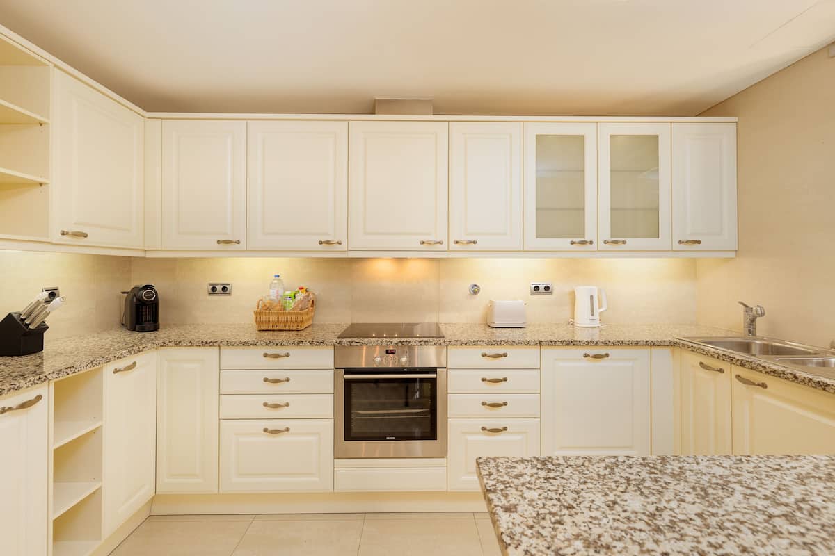 espresso maker, coffee/tea maker, electric kettle, dining tables