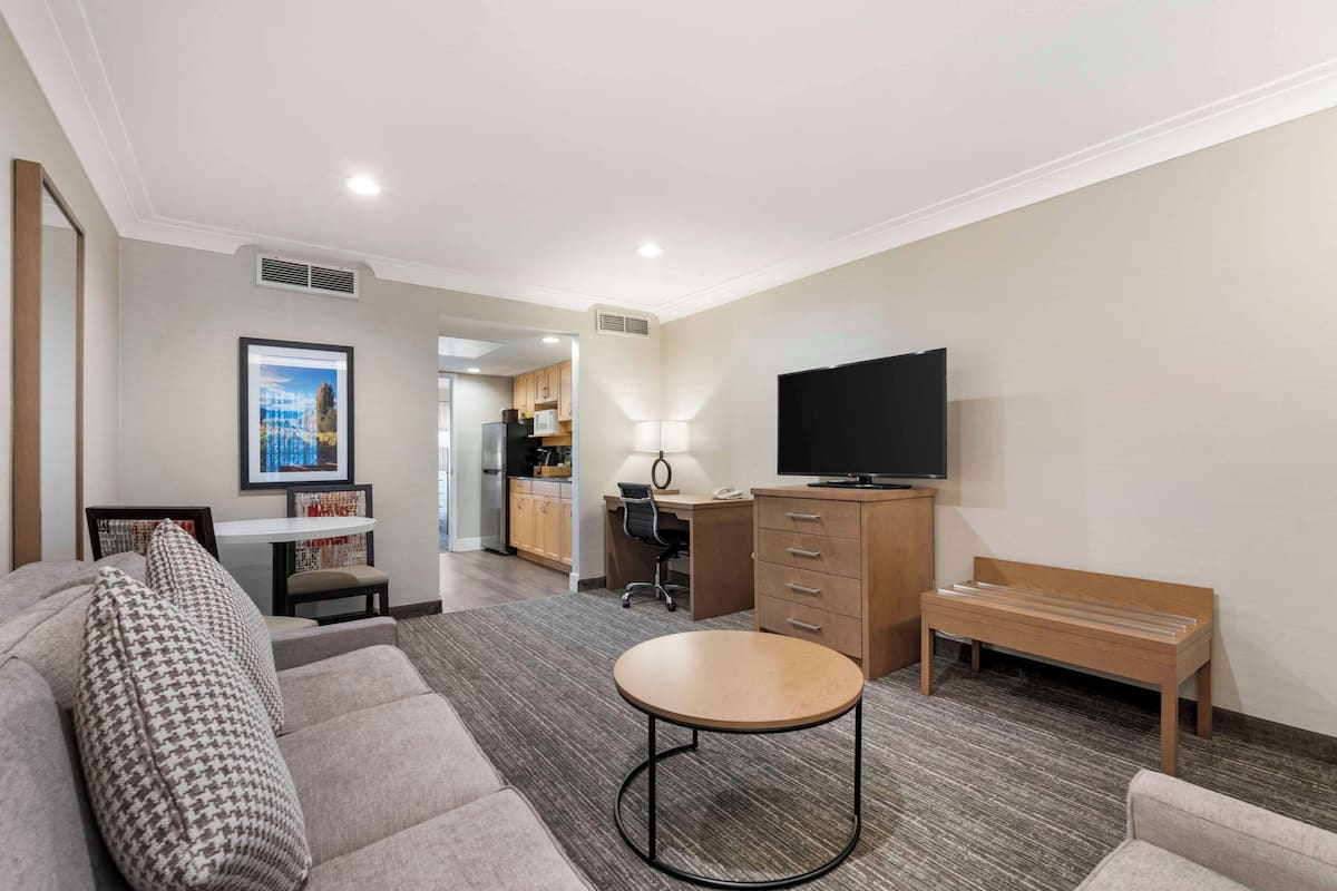 Premium bedding, desk, laptop workspace, blackout curtains