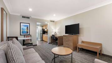 Premium bedding, desk, laptop workspace, blackout curtains