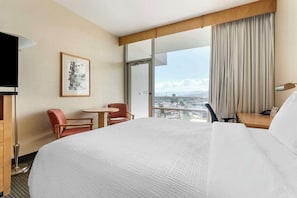 Premium bedding, desk, laptop workspace, blackout curtains