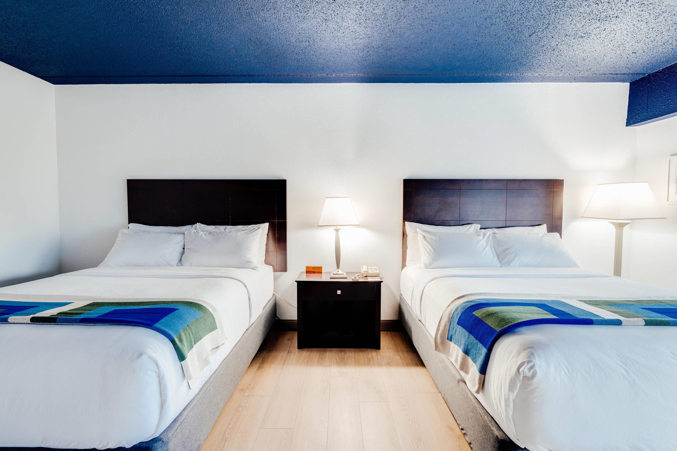 Hypo-allergenic bedding, desk, laptop workspace, blackout curtains