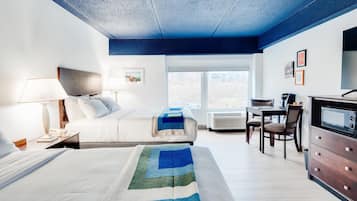 Hypo-allergenic bedding, desk, laptop workspace, blackout drapes