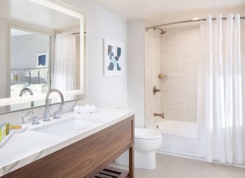Eco-friendly toiletries, hair dryer, towels, soap at Hilton Santa Monica Hotel & Suites