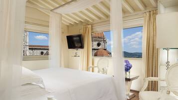 Premium bedding, down comforters, minibar, in-room safe