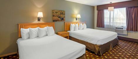 A hotel room with two beds, a large window with curtains, an air conditioning unit, and a wall-mounted painting.