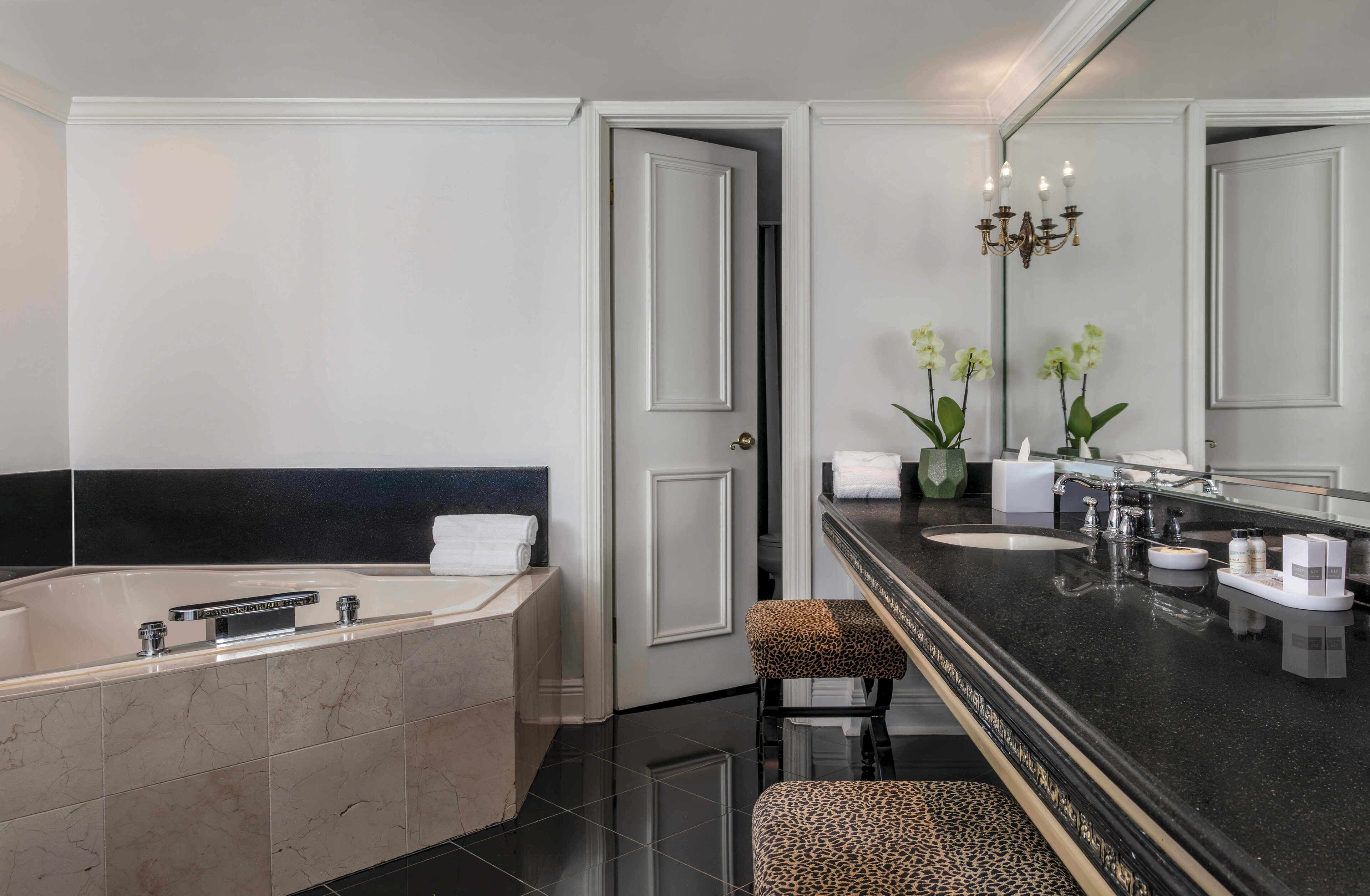 presidential suite, 1 king bed with sofa bed, hot tub, courtyard view (presidential suite) | bathroom | shower, designer toiletries, hair dryer, towels
