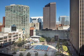 A cityscape with modern buildings, including a hotel with a large sign and a prominent skyscraper. - The Westin Cincinnati (Cincinnati)
