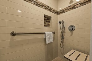 Combined shower/tub, designer toiletries, hair dryer, towels