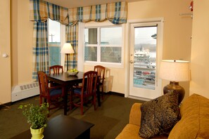 Suite, 1 King Bed with Sofa bed | Living area | 37-inch flat-screen TV with cable channels, TV, iPod dock