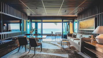 Suite (Manele) | Living area | 75-inch LED TV with cable channels, TV, DVD player