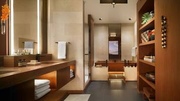 Bathroom features a large mirror, sink, and separate shower area.