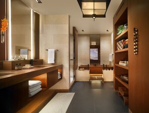 Separate tub and shower, designer toiletries, hair dryer, bathrobes