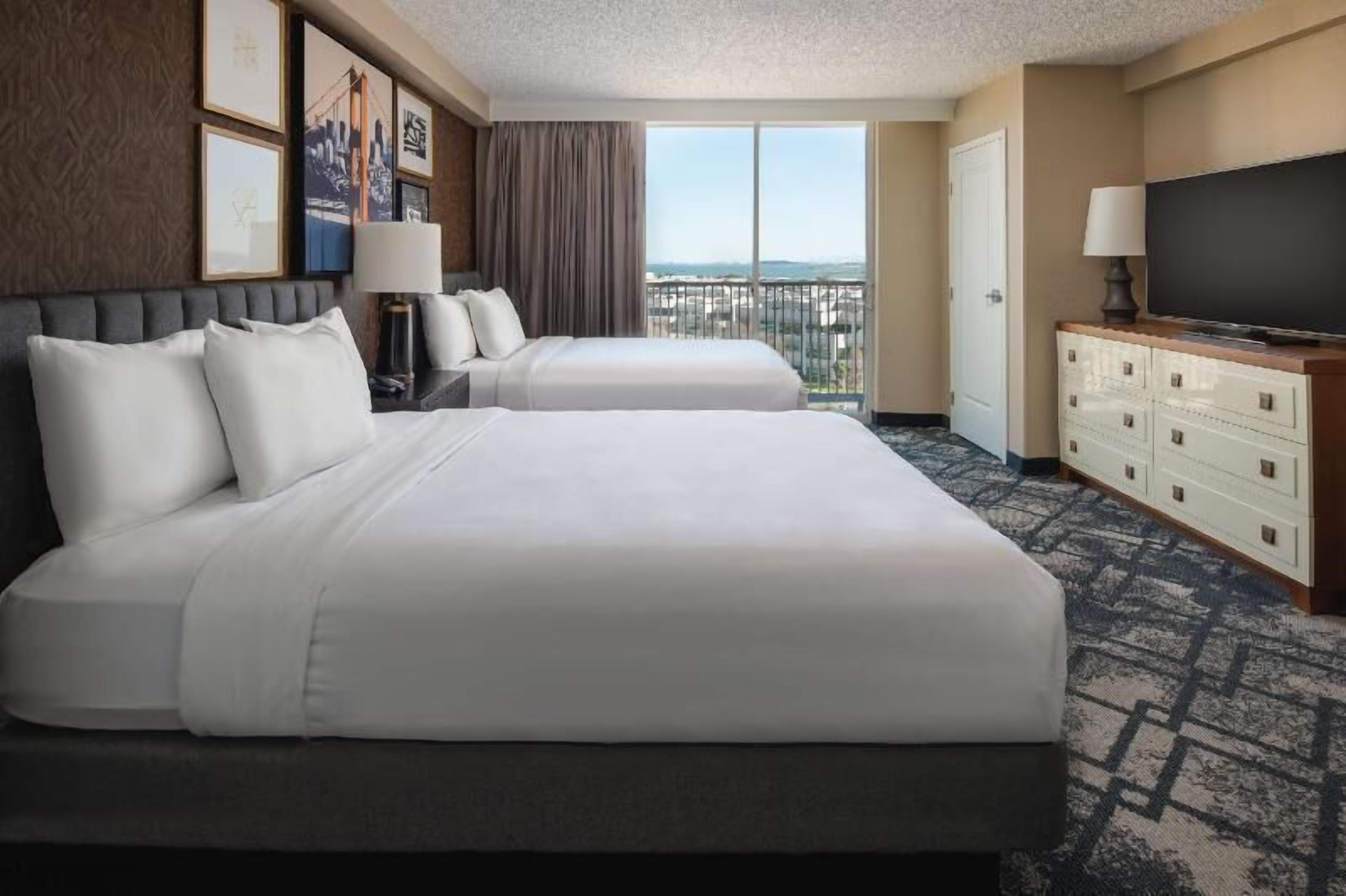 Premium bedding, down duvets, pillow-top beds, in-room safe