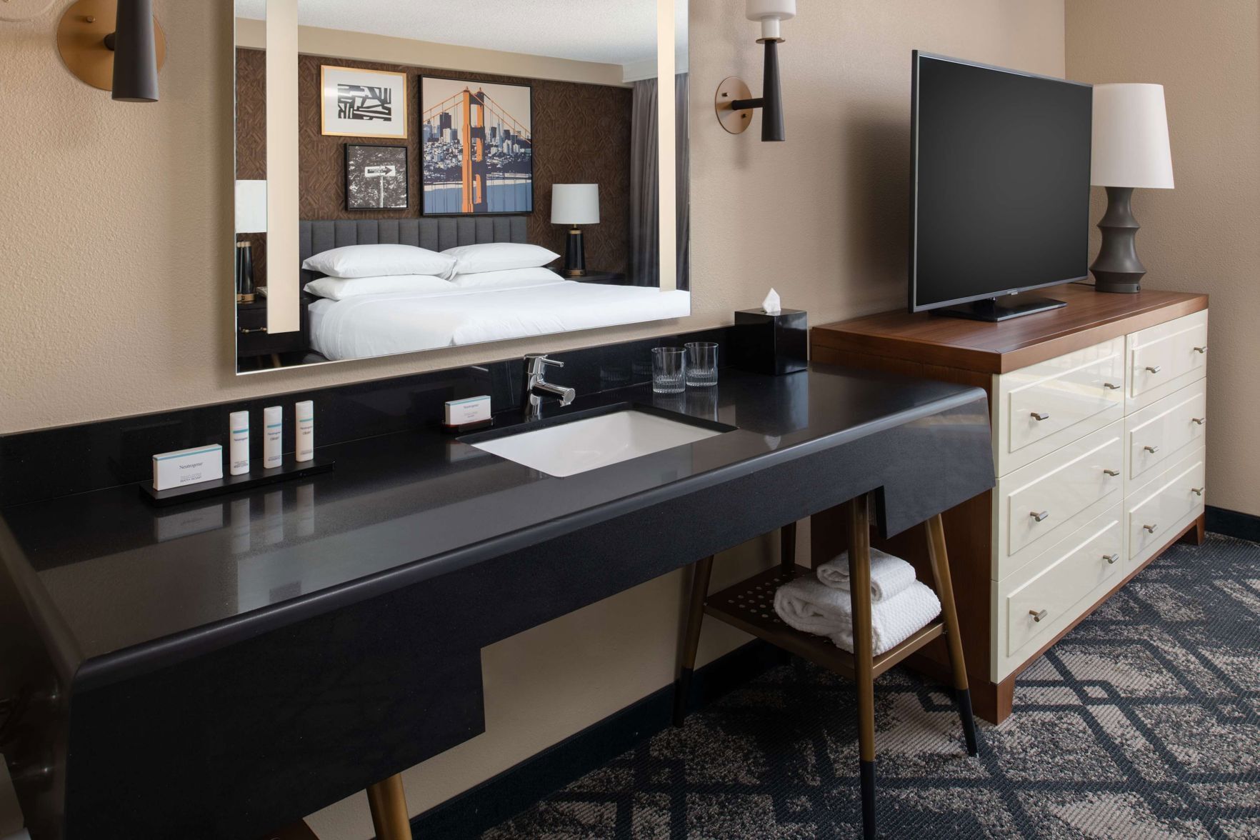 Premium bedding, down comforters, pillowtop beds, in-room safe