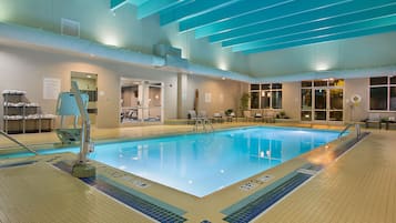 Indoor pool, open 7:00 AM to 11:00 PM, pool loungers