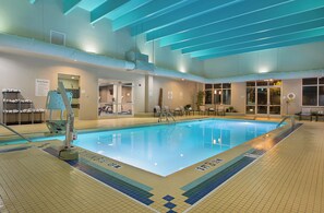 An indoor swimming pool with clear lane markings, a lifeguard chair, and pool rules posted on the wall. - Crowne Plaza Bowling Green KY by IHG (Bowling Green)