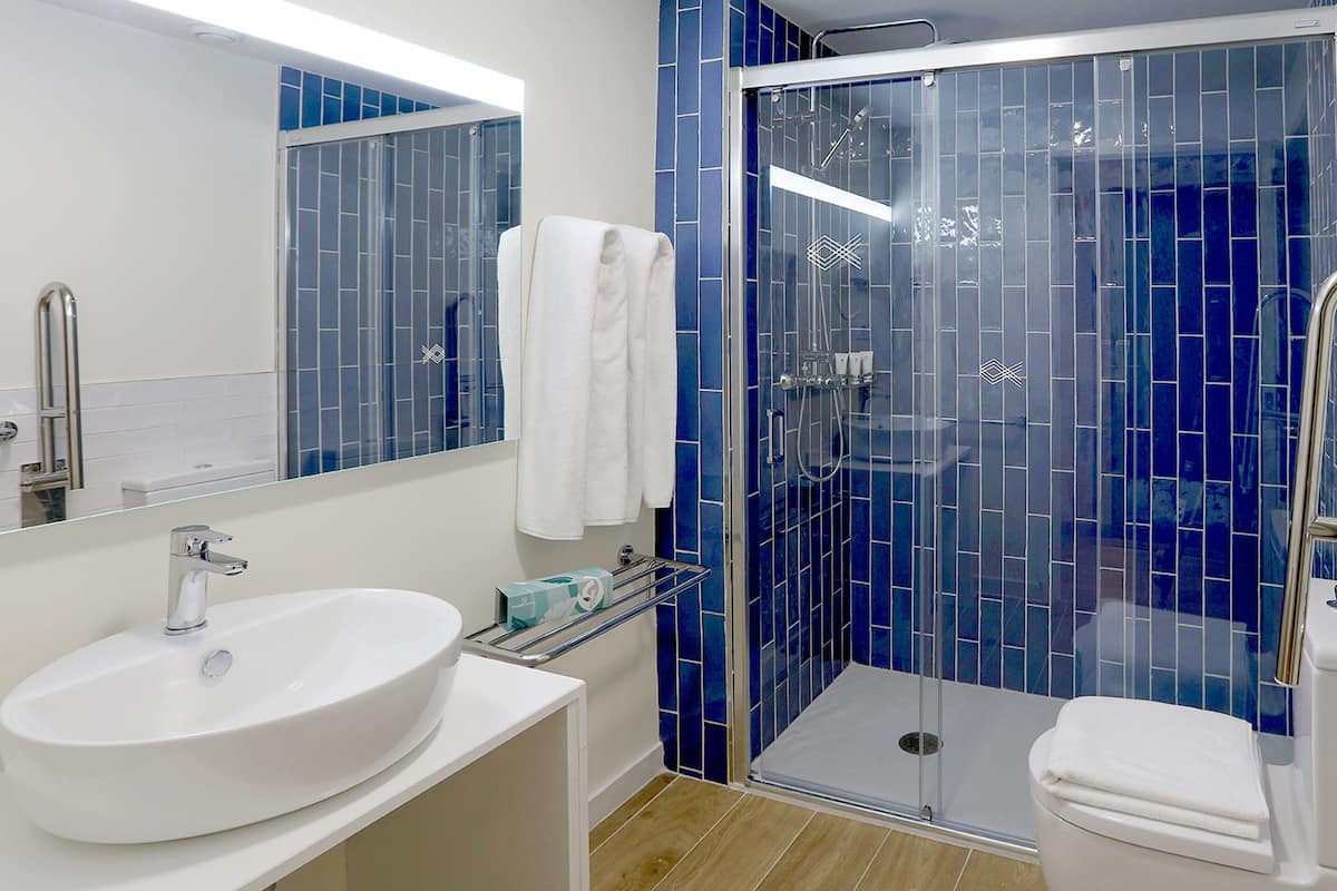 shower, eco-friendly toiletries, hair dryer, towels