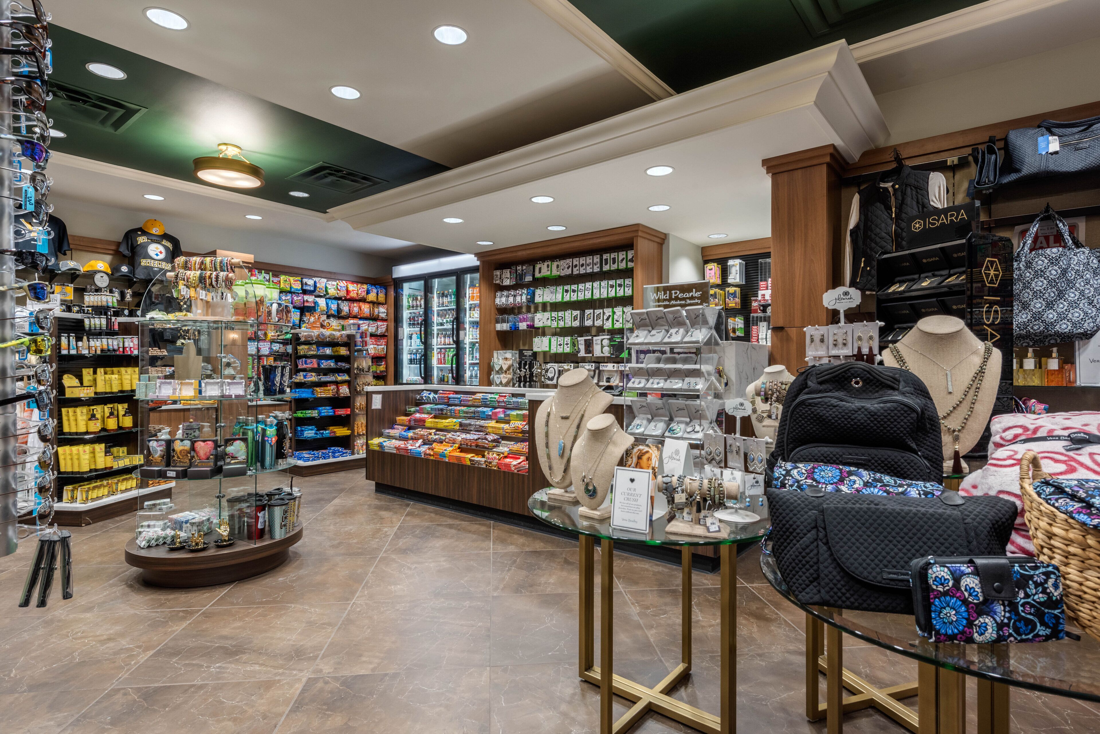 A jewelry store with various items on display, including necklaces, bracelets, and bags.