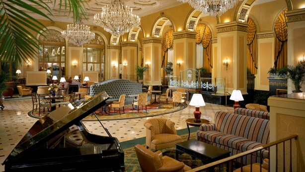 A grand lobby with a grand piano, plush seating, chandeliers, and ornate decor. - Omni William Penn Hotel (Pittsburgh)