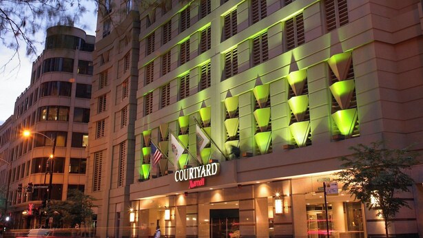 A multi-story hotel with a modern facade, featuring a prominent 'Courtyard' sign. - Courtyard by Marriott Chicago Downtown River North (Chicago)