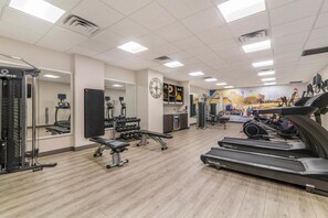 A gym with treadmills, weight machines, and free weights. - Best Western Plus Waltham Boston (Waltham)