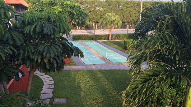 Indoor pool, outdoor pool, open 8 AM to 10 PM, pool loungers - Days Inn by Wyndham West Palm Beach (West Palm Beach)