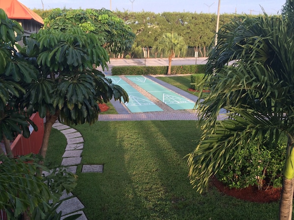 Outdoor pool, open 8 AM to 10 PM, pool loungers