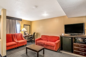 Suite 1 King bed | Living area | 42-inch LCD TV with cable channels, TV