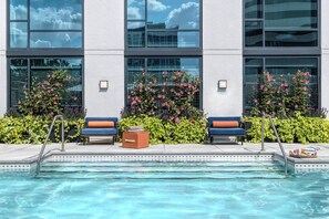 Outdoor pool, open 8:00 AM to 8:30 PM, pool umbrellas, pool loungers