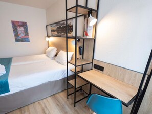 Premium bedding, desk, laptop workspace, blackout curtains