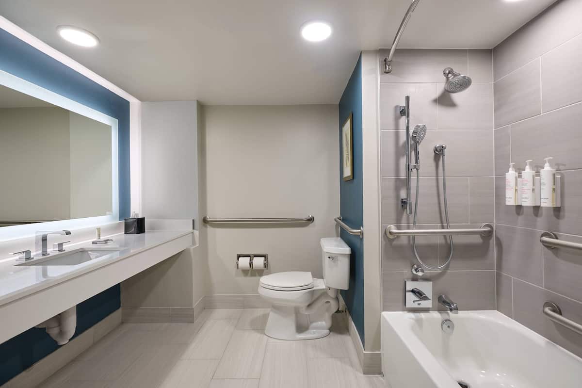 Combined shower/bathtub, designer toiletries, hair dryer, bathrobes