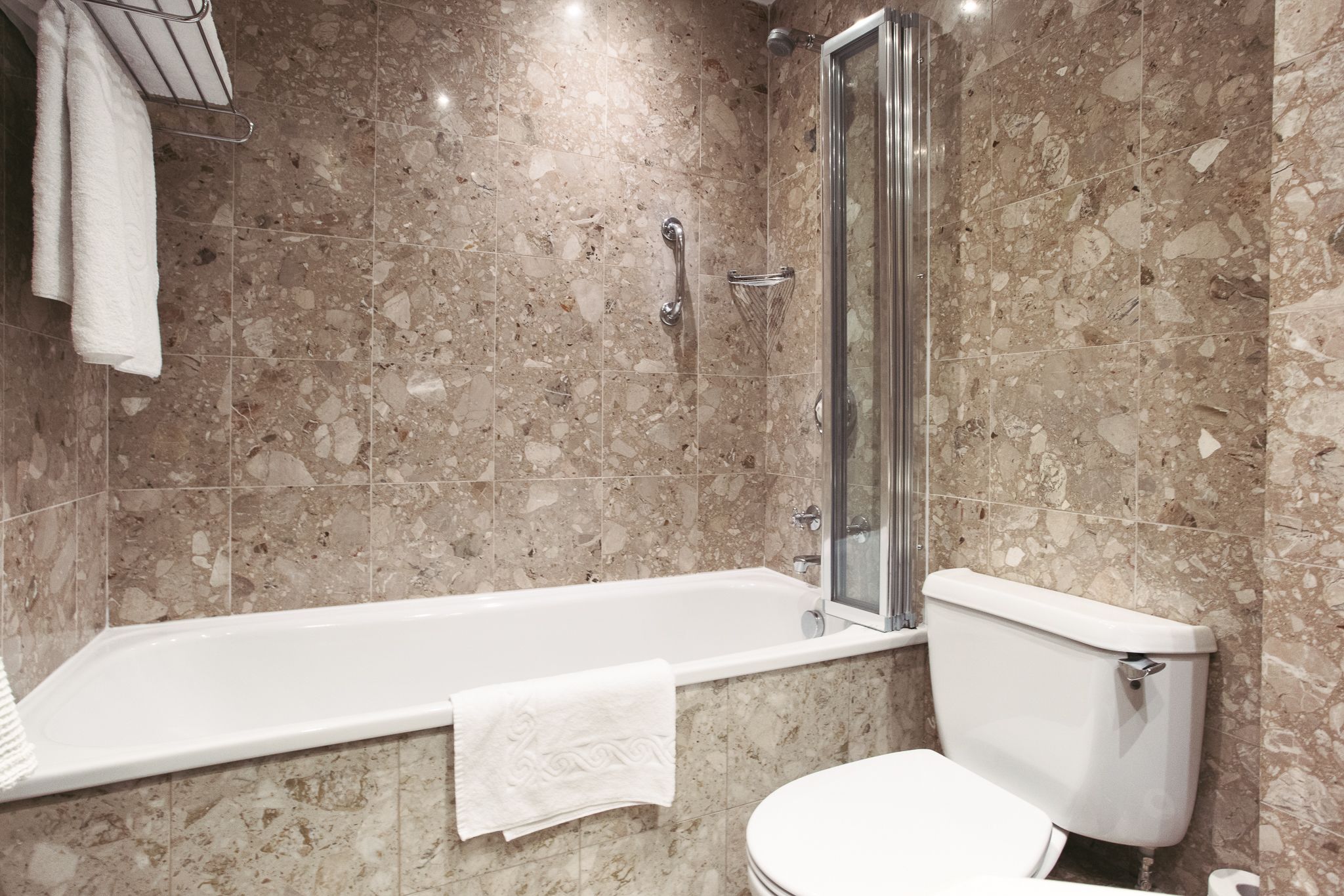 shower, designer toiletries, hair dryer, towels