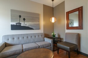 Pool View King Suite Sleeper Sofa | Living area | Flat-screen TV