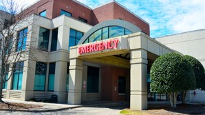 A building with a prominent "EMERGENCY" sign above the entrance.