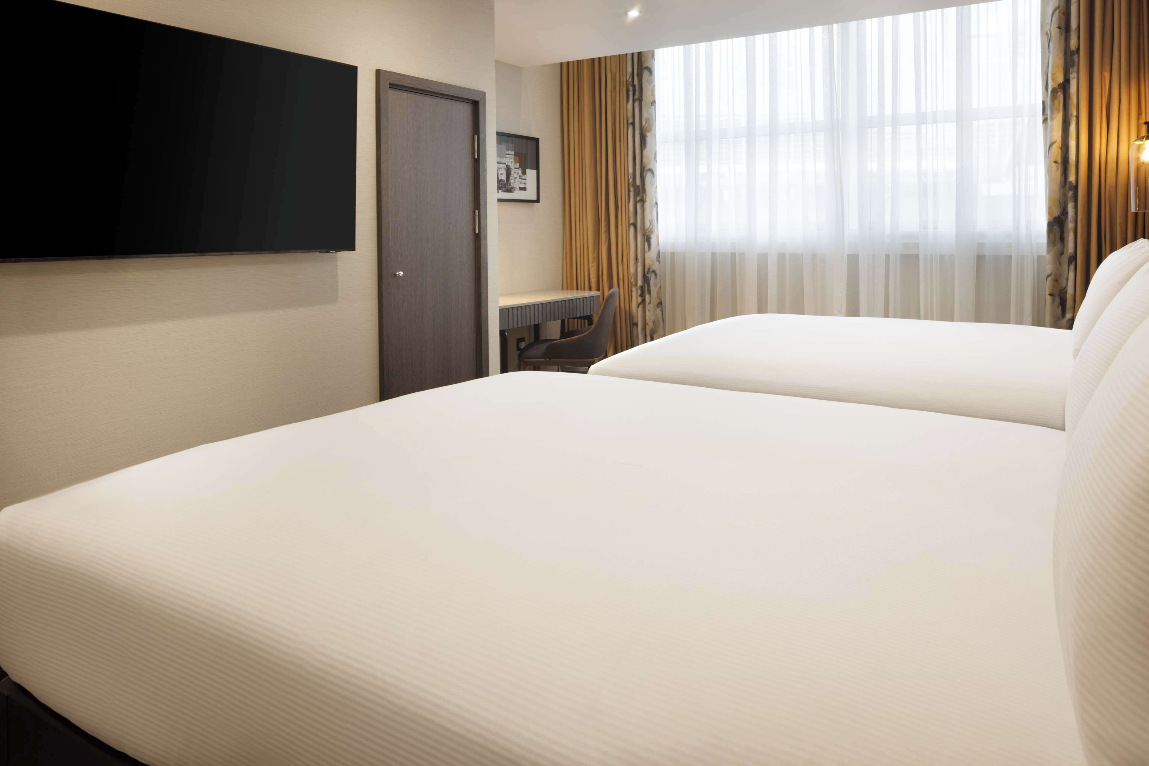 suite, 2 double beds | in-room safe, desk, laptop workspace, blackout curtains