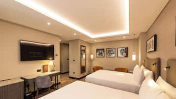 Deluxe Room, 2 Double Beds | In-room safe, desk, laptop workspace, blackout drapes