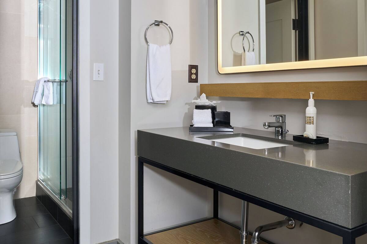 studio suite | bathroom | designer toiletries, hair dryer, bathrobes, slippers