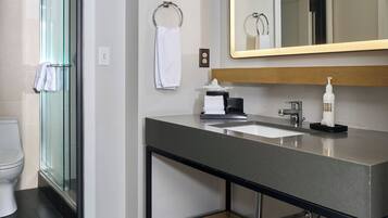 Studio Suite | Bathroom | Designer toiletries, hair dryer, bathrobes, slippers