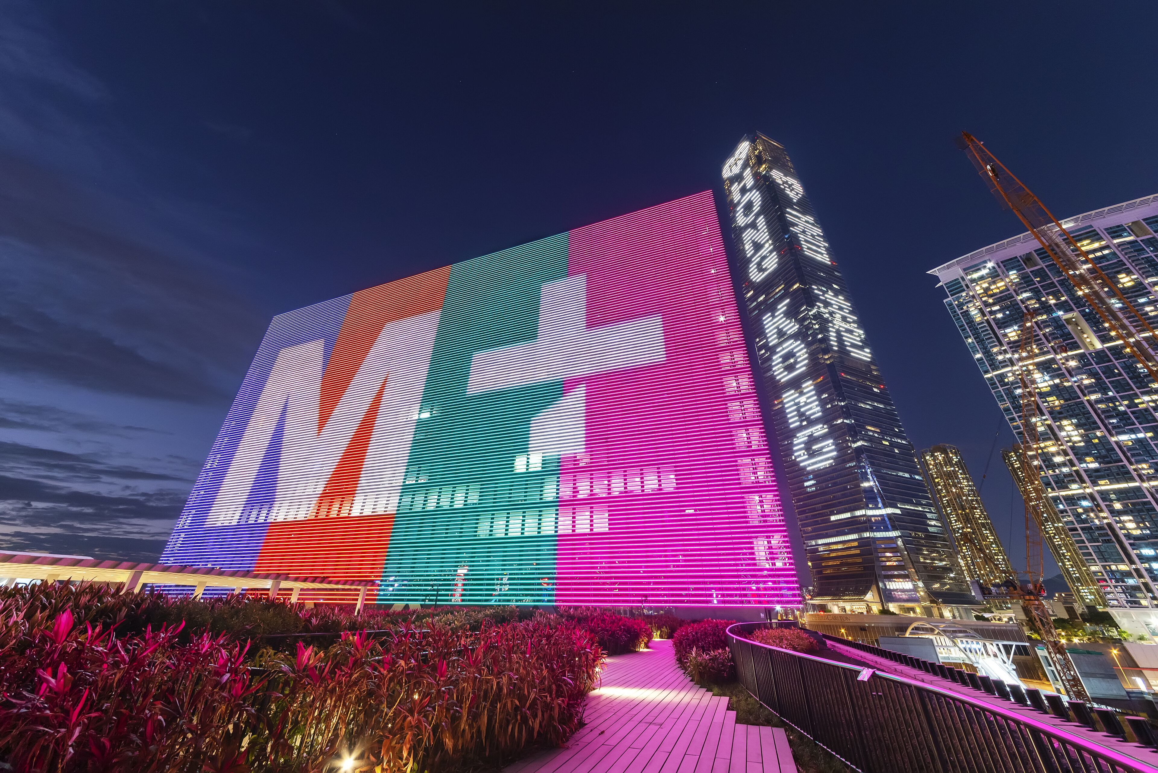 A modern building with a large digital display on its facade.