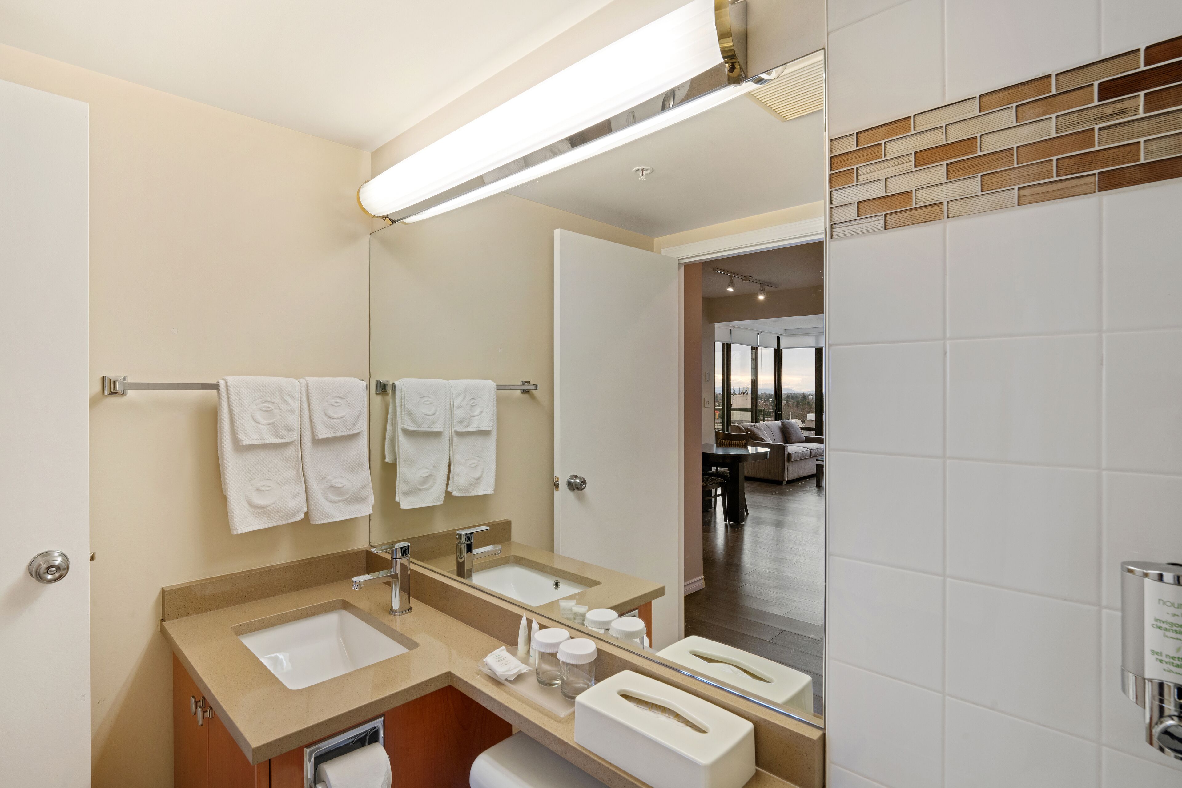 combined shower/bathtub, designer toiletries, hair dryer, towels