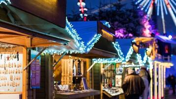 A wooden structure with a display of various items, possibly for sale.