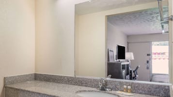 Separate bathtub and shower, eco-friendly toiletries, hair dryer, towels