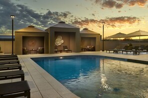 Outdoor pool, open 9:00 AM to 10:00 PM, free cabanas, pool umbrellas