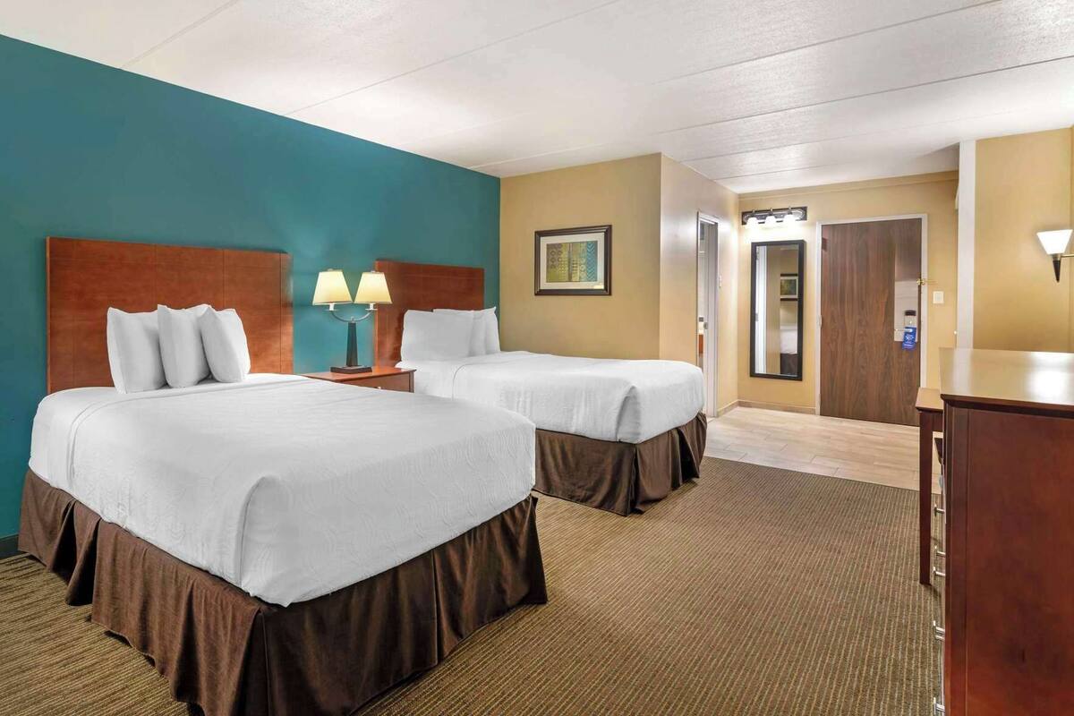 Pillow-top beds, desk, laptop workspace, blackout curtains
