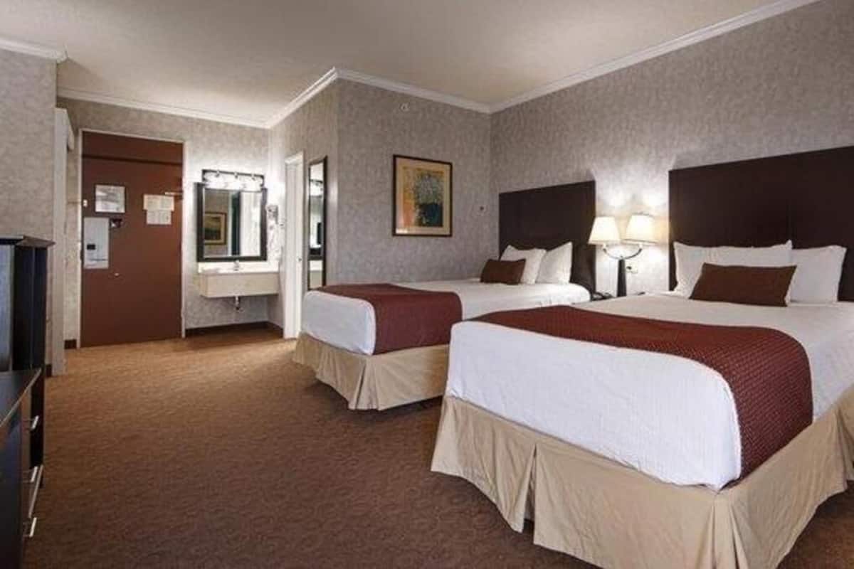 Pillow-top beds, desk, laptop workspace, blackout curtains