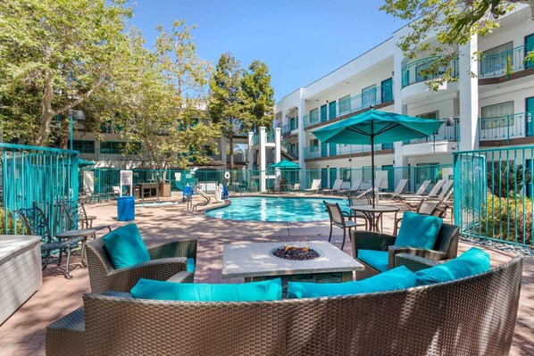 Outdoor pool, open 10:00 AM to 10:00 PM, pool umbrellas, sun loungers