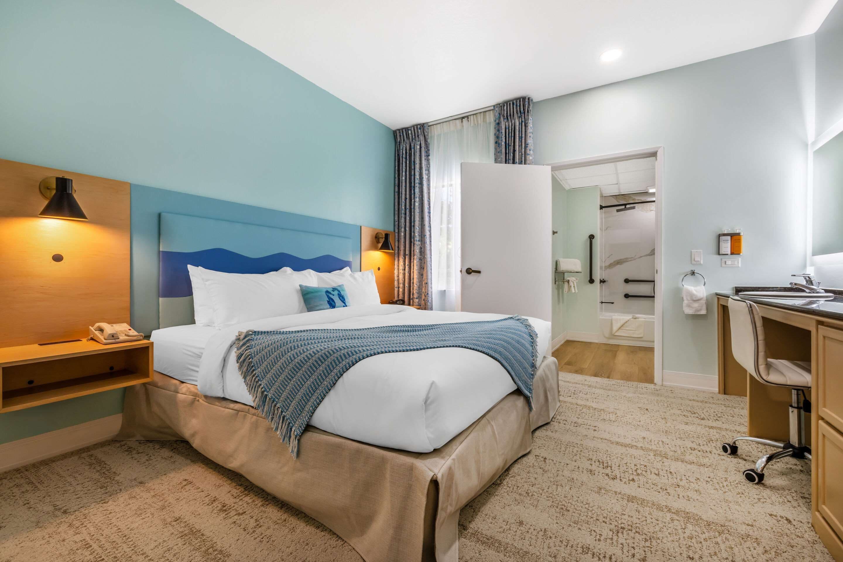 suite, 1 king bed with sofa bed, accessible, non smoking (roll-in shower) | premium bedding, in-room safe, desk, iron/ironing board