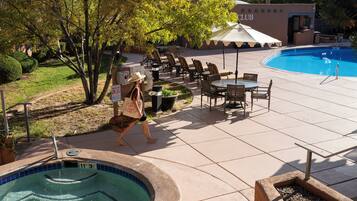 Seasonal outdoor pool, open 9:00 AM to 10:00 PM, pool umbrellas